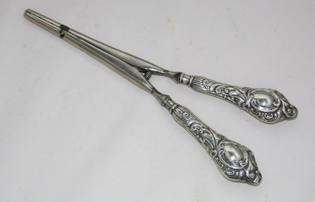 Edwardian Silver Repousse Handled Glove Stretchers: Edwardian Sterling Silver Repousse Handled Glove Stretchers by William Harrison Walter. Hallmarked Birmingham 1906-07. Length 8 inches.