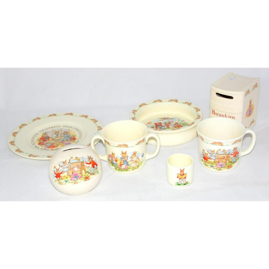 Royal Doulton "Bunnykins" Collection: Royal Doulton "Bunnykins" Collection to Include: Loving Cup,Money Boxes x 2,Egg Cup,Tea Mug,Cerial Bowl and Christening Plate. (7 Items)