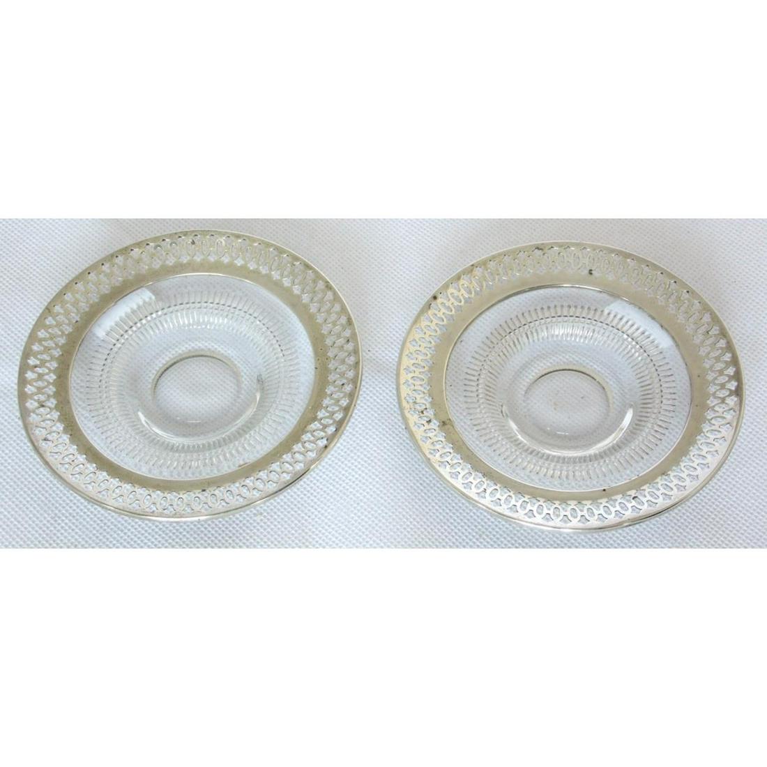 A Pair of Webster Co.Pin Dishes: A Pair of Webster Company USA Pierced Sterling Silver Mounted Glass Circular Pin Dishes. Early 1900s. Marked Sterling. Diameter 4 inches.(2 Items)