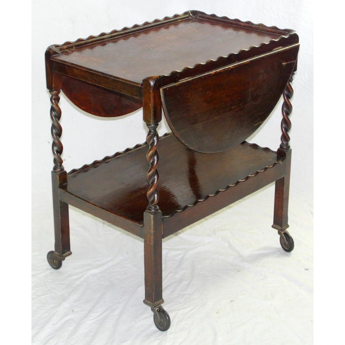 1920s Oak Barley Twist Tea Trolley.: 1920s Oak Barley Twist Tea Trolley. Height 28 in. Width 25 in. Depth 17 to 36 inches