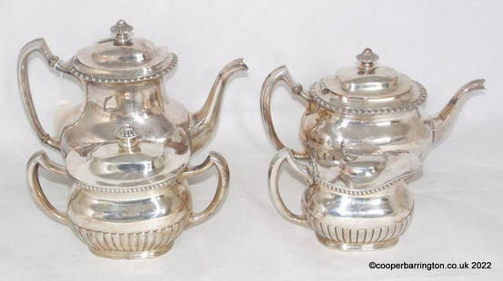 Antique Edwardian Silver Plate Tea/Coffee Set: Reed And Barton Edwardian Silver Plate Tea Set Coffee Service. Early 1900s. The set includes coffee pot, teapot, sugar bowl and creamer. Each piece has an ornate, fluted base and rim. (4 Items)