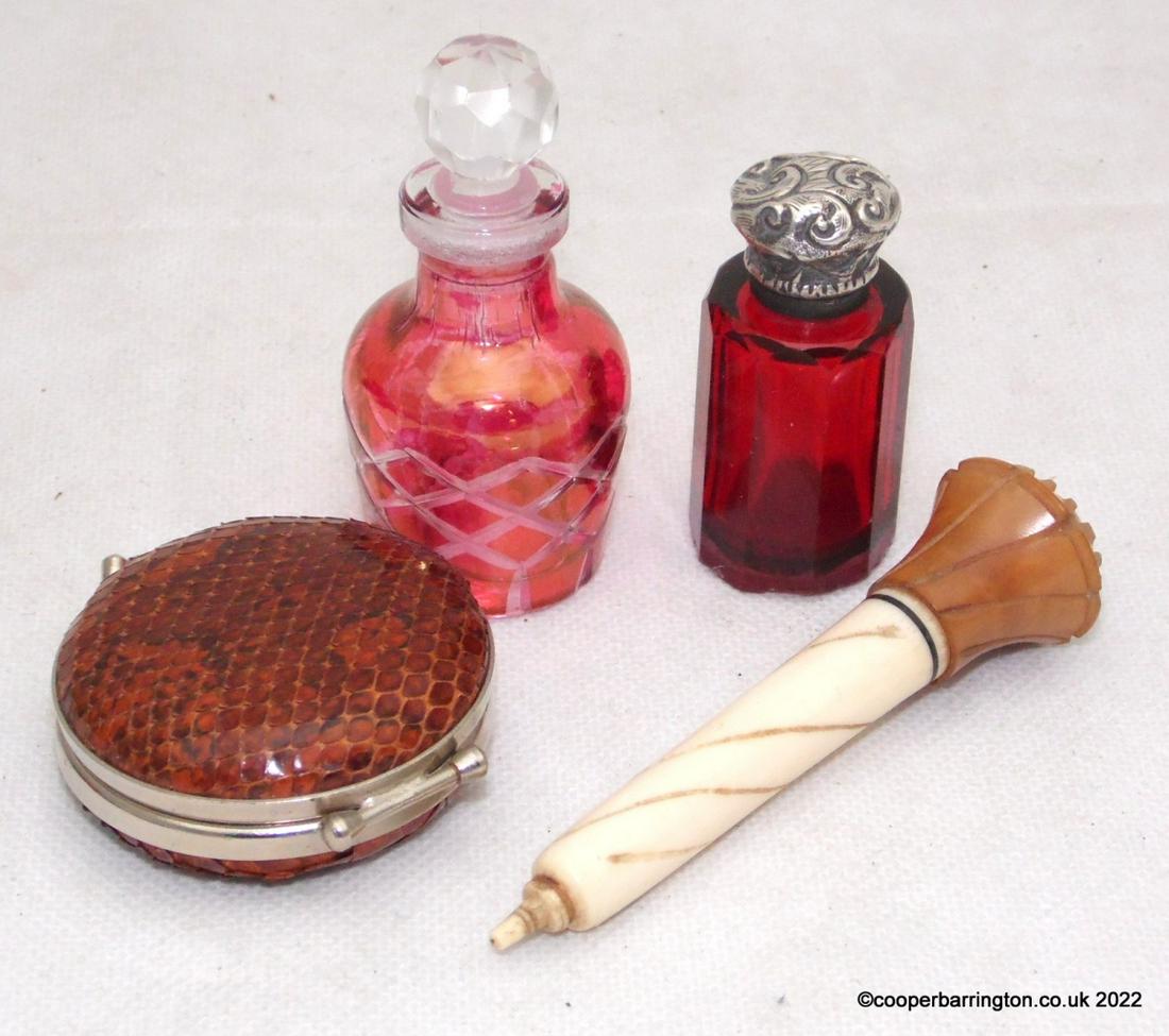 Job Lot: Job Lot To Include:Silver Topped Ruby Glass Perfume Bottle. Cranberry Glass Perfume Bottle. Carved Bone Needle Case and a Snake Skin Covered Purse. (4 items)