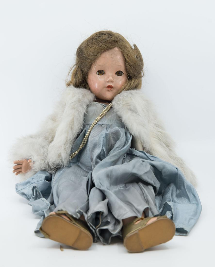 Antique Porcelain Doll: vintage doll with open/shut eyes hand painted with handmade clothing and rabbit fur coat