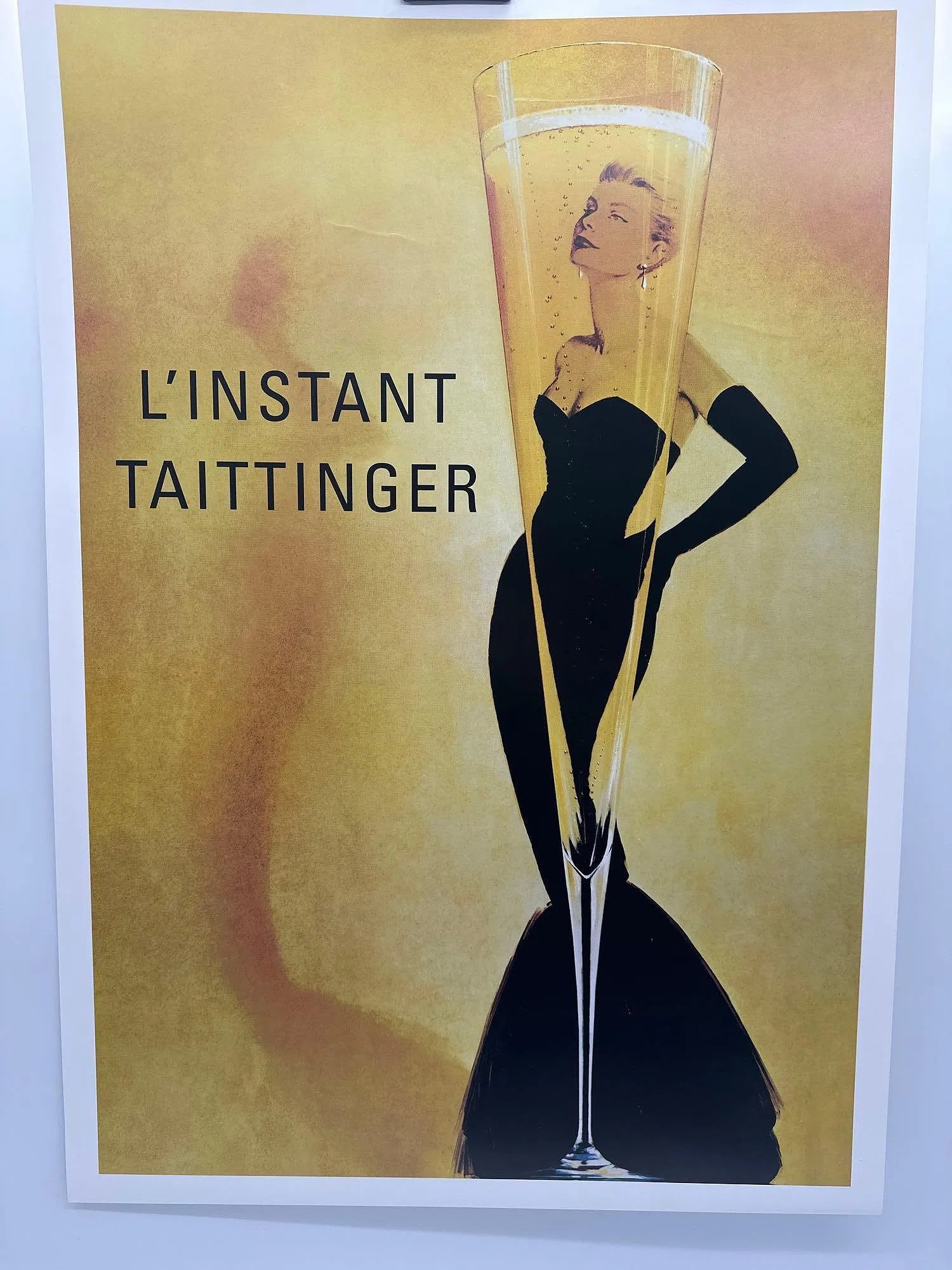 L’Insant Taittinger Grace Kelly Champagne Poster: Title: L’Instant Taittinger Dimensions: 25 in. X 36 in Medium: Poster on Paper Condition: Excellent