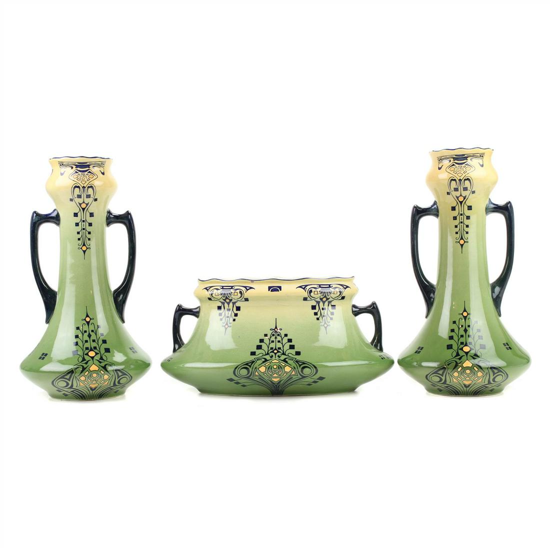 FAÃENCERIE DE FIVES. ART NOUVEAU VASES AND CENTRE: Earthenware, stamped and numbered on base. 28 x 14 x 14 cm; 15 x 29 x 12 cm.