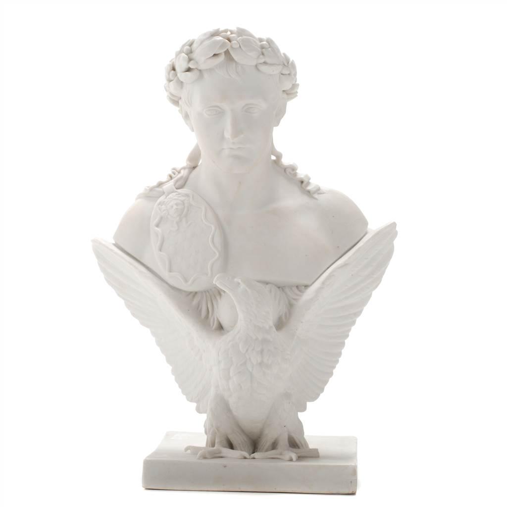 ROYAL COPENHAGEN. BUST OF NAPOLEON I, SECOND HALF 19TH: Biscuit figure, after the model of the sculpture by Bertel Thorvaldsen from 1830. In Empire style, he is depicted with a crown of laurels and a shield hanging from his shoulder. The bust rests on the