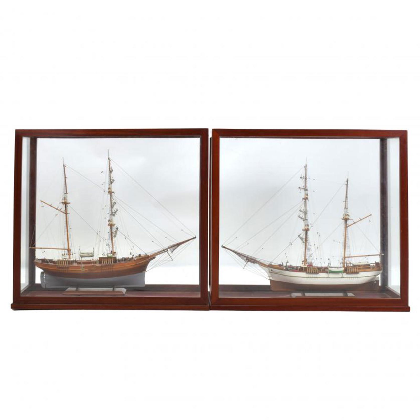 TWO SPANISH SHIP MODELS, 20TH CENTURY.: Wood and fabric.Both kept in a display case.70.5 x 76 x 33 cm and 71 x 76 x 33 cm.