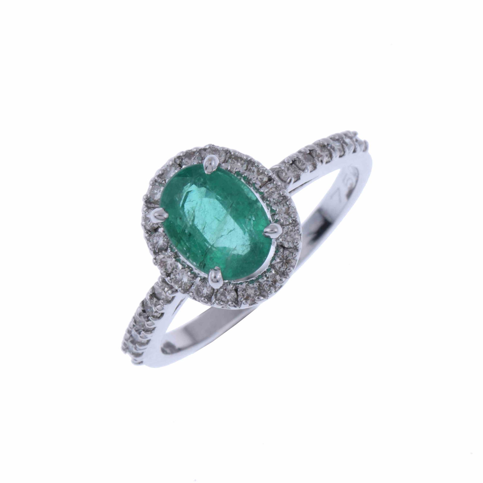 EMERALD AND DIAMONDS ROSETTE RING.: White gold with an oval cut emerald of 1 ct., and brilliant cut diamonds of 0.30 ct. total weight. Hoop 17 mm. Number 14.