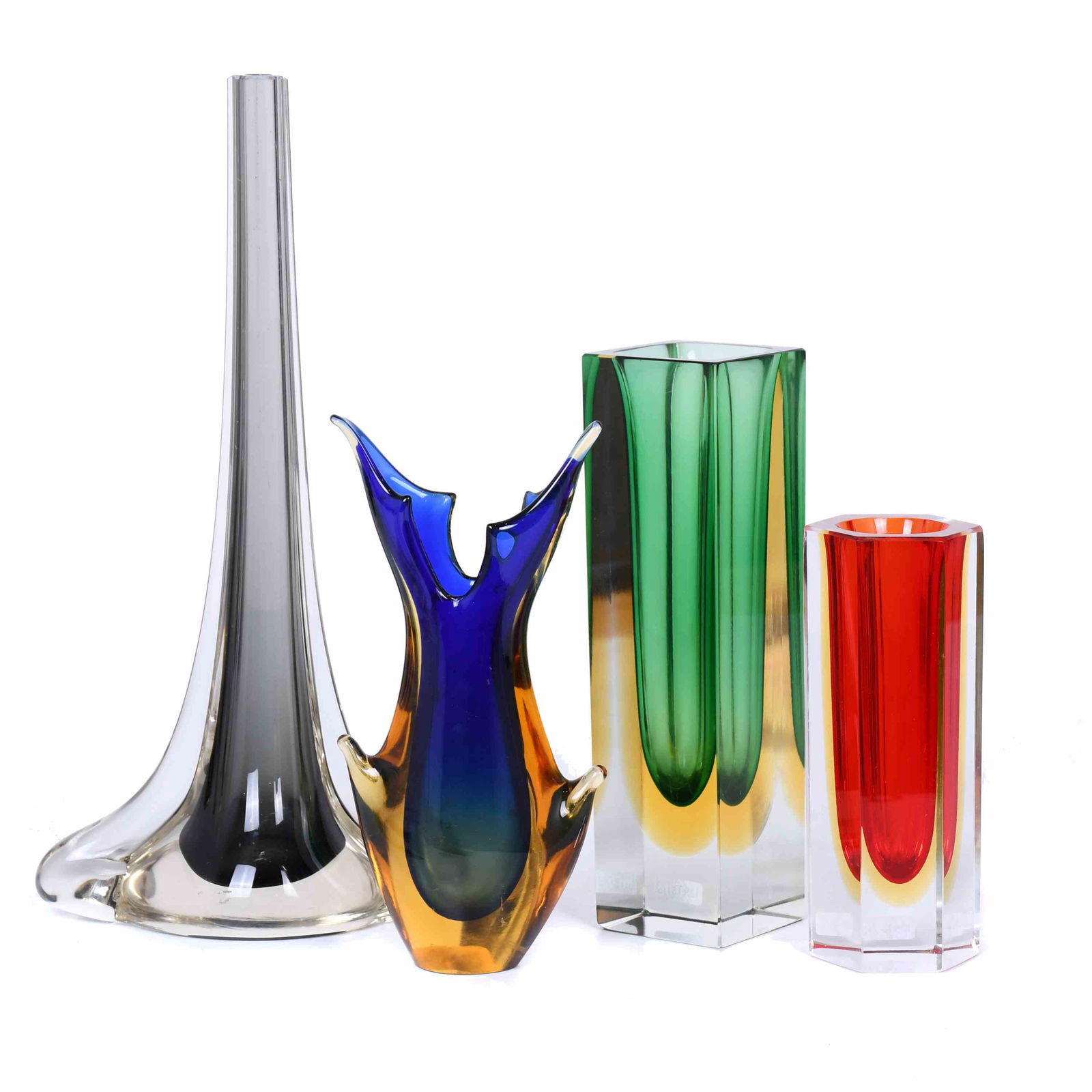 FLAVIO POLI (1900-1984). SET OF FOUR SMALL VASES.: Murano glass in different colours and shapes. Height of the largest: 30 cm; height of the smallest: 15 cm.