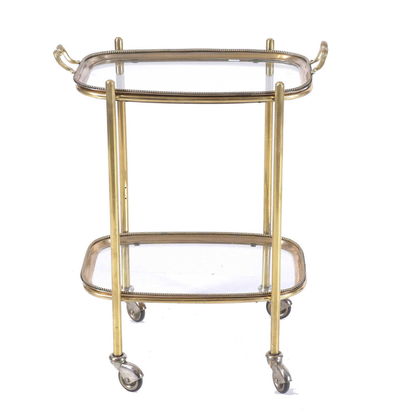 DRINKS TROLLEY, MID 20TH CENTURY.: Gilded metal with glass tops. Magnetic and removable tops that can be reconverted into a tray. With castors. 60 x 48 x 30 cm.