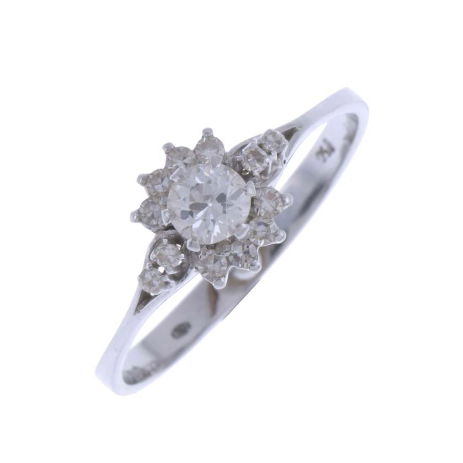ROSETTE RING WITH DIAMONDS: 18kt. white gold, and brilliant cut diamonds, central diamond of 0.3 ct. Size 17/57 with reducing ball, no 20/60. Total weight: 2.5 gr.
