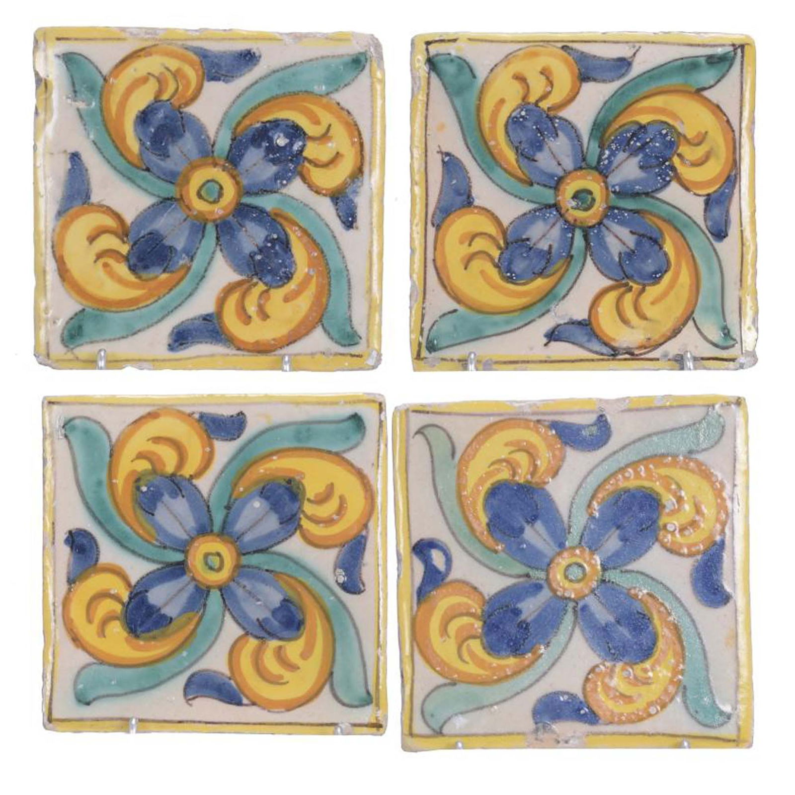 SET OF FOUR TILES, 18TH CENTURY.: Polychrome earthenware with floral motif. They have chipping and small defects due to age. 11.5 x 11.5 x 1.5 cm.