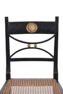 Pair of Regency chairs, 19th century.: Carved, polychrome and gilded wood. Mesh seats.Holes caused by apparently inactive wood-eating insects, and defects.84.5 x 46 x 52 cm.