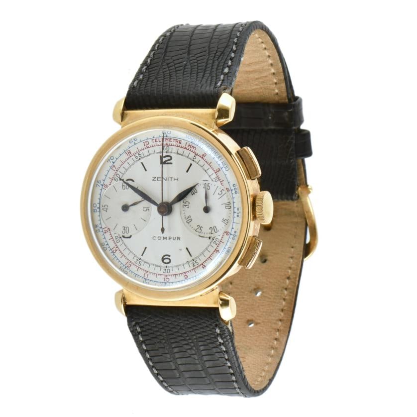 ZENITH Compur Chrono, wristwatch.: 18kt yellow gold case of 34 mm. Leather watchband. Arabic numerals and telemeter on the dial. Manual winding movement, with seconds dial at six o'clock. 45-minute chronograph at three o'clock. In runn