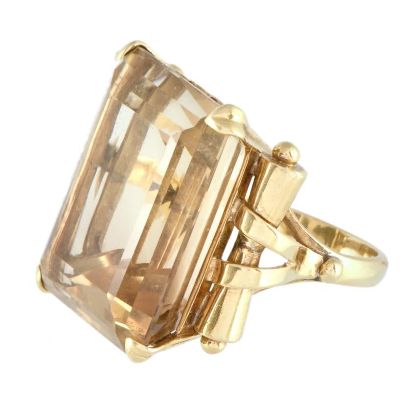 Ring with large citrine, 1960's.: 18kt yellow gold. Rectangular cut citrine.Size: 14/54.Weight: 18 gr.