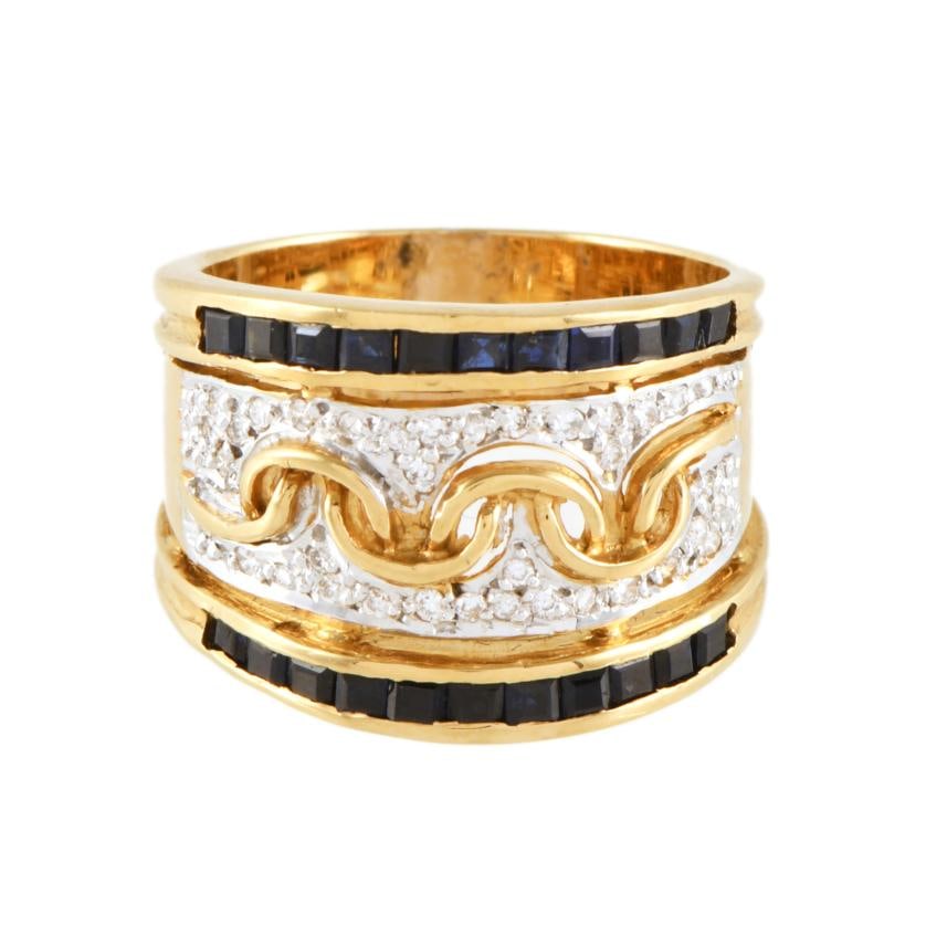 Wide ring with sapphires and diamonds.: 18 ktyellow gold, brilliant cut diamonds and cushion cut sapphires.Size 15/55.