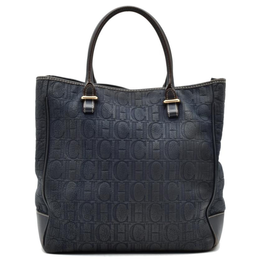 CAROLINA HERRERA, hand bag.: Leather with the brand's logo and gilt metal details. Signs of wear. Including original dust cover. 49 x 34 x 17 cm.