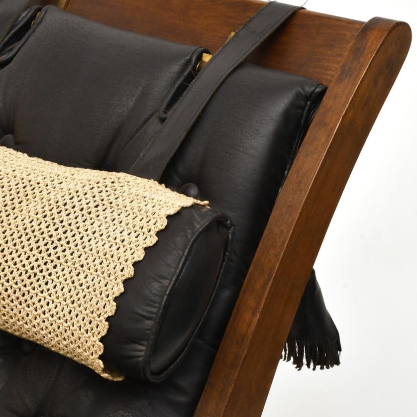 VALENT?. Leather armchair with ottoman, mid 20th century.: Stained oak wood with black leather tufted upholstery. With manufacturer's mark, probably based on a design by Pierre Lottier. Wear and tear, especially on the leather. Scratches on the legs. There ar