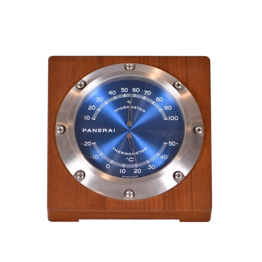 PANERAI. Desktop thermometer and hygrometer, model ‘PAM 256’, 2011.: Stainless steel and teak wood case. Blue dial with Arabic numerals and white tracks. 7.5 x 15 x 15 cm.