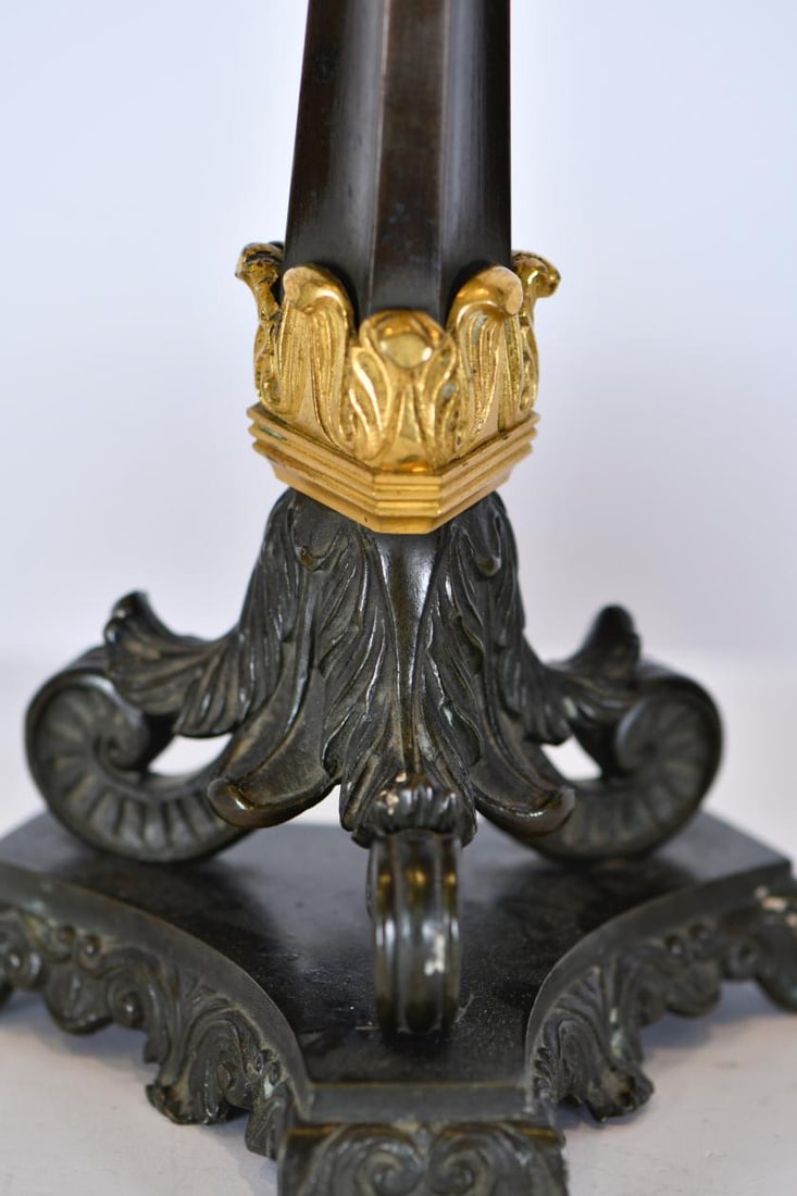 Pair of Charles X candlesticks, 1820–1830.: Bluing bronze with ormolu details. Wear due to age. 34.5 x 15.5 x 14 cm.