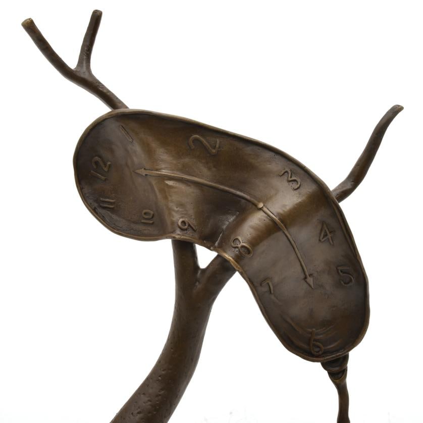 AFTER MODELS BY SALVADOR DAL?, 'Tree with a clock'.: Bronze, with black marble stand. Signed on the base. 29 x 20 x 12.5 cm.