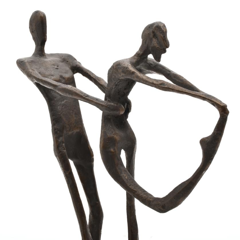 AFTER MODELS BY ALBERTO GIACOMETTI. Dancers.: Bronze, with black marble base. 42 x 32 x 10 cm.