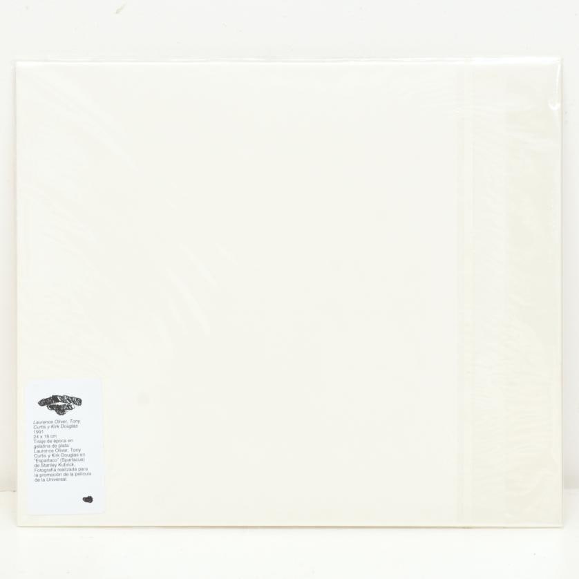 Laurence Oliver, Tony Curtis and Kirk Douglas. 1991.: Vintage silver gelatin print. Laurence Olivier, Tony Curtis and Kirk Douglas in Stanley Kubrick's 'Spartacus'. Photograph taken to promote the Universal film. 18 x 24 cm (photo).