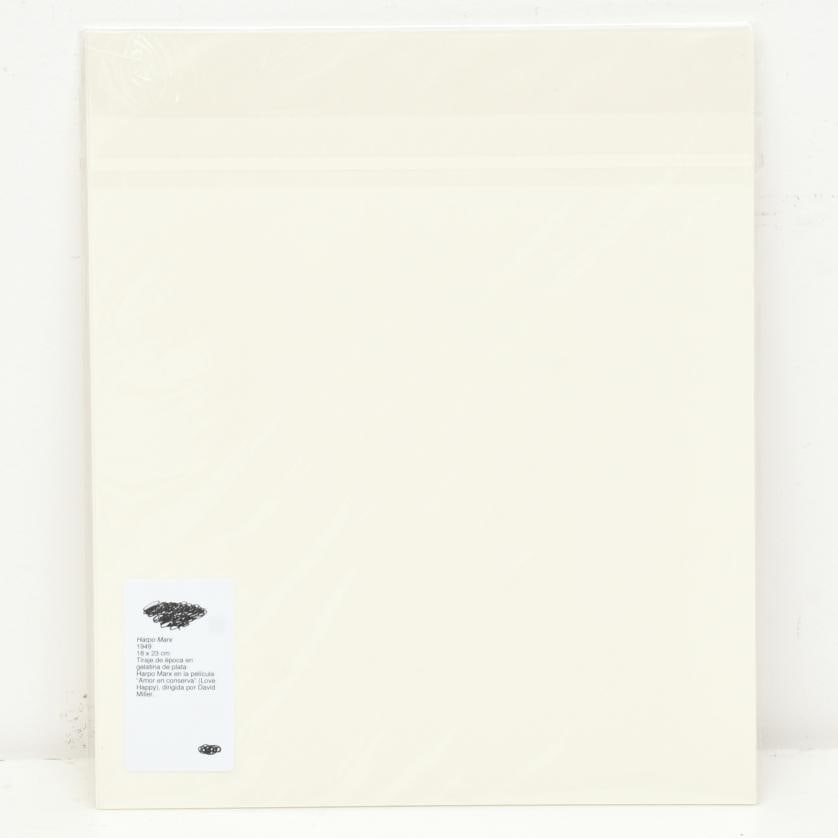 Harpo Marx. 1949.: Vintage silver gelatin print. Harpo Marx in the film ‘Love Happy’, directed by David Miller. 23 x 18 cm (photo).