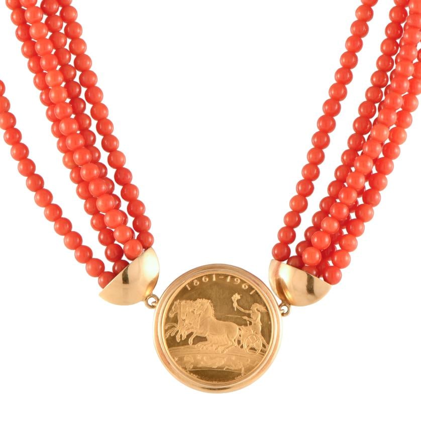 Necklace with coral beads with coin-shaped pendant. (1 of 2)