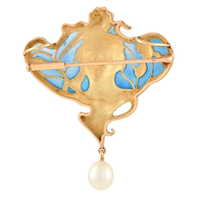 Pendant brooch based on designs by Masriera: 18 kt yellow gold. A natural pearl, and enamel. Weight: 1.5 gr.