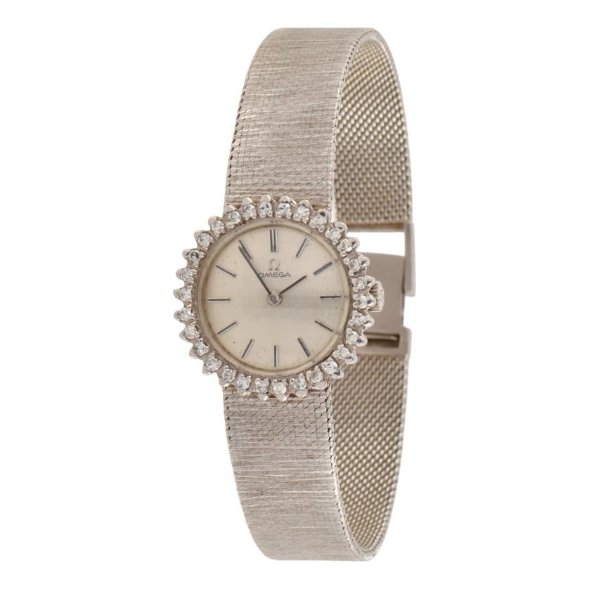 OMEGA, wristwatch-jewel with diamonds.: 18 kt white gold case and watchband. Bezel with brilliant cut diamonds. Watchband: 17.5 cm Manual winding movement. In running order at the time of cataloguing.