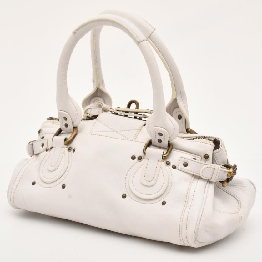 CHLOÉ. Paddington bag.: White leather. Without lock. Wear and tear. 18 x 35.5 x 18.5 cm.