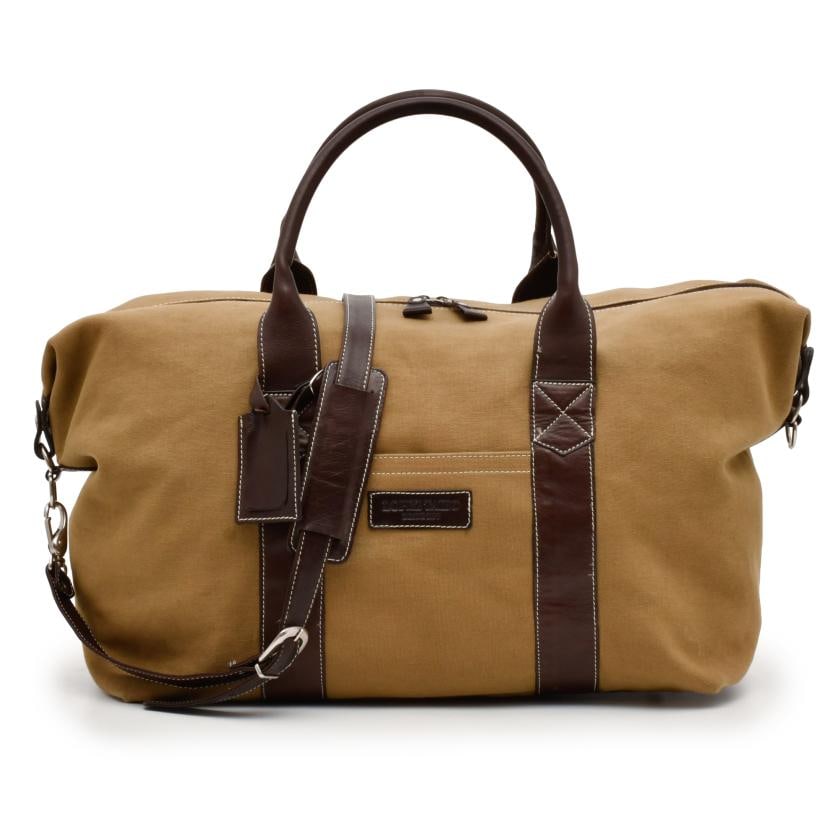 LOPEZ TAIBO. Travel bag.: Cotton canvas and leather. Silvery metal fittings.Slight marks of use.25 x 50 x 22 cm approx.