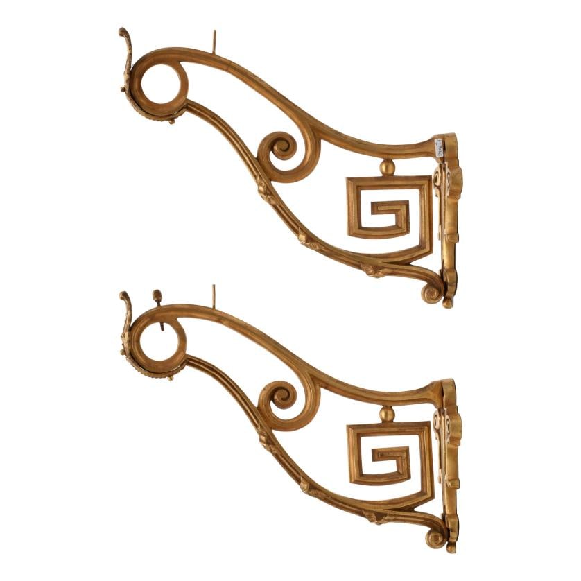 Pair of curtain rod brackets.: Gilded bronze. Minor flaws. 19.5 x 11.5 x 37 cm approx.