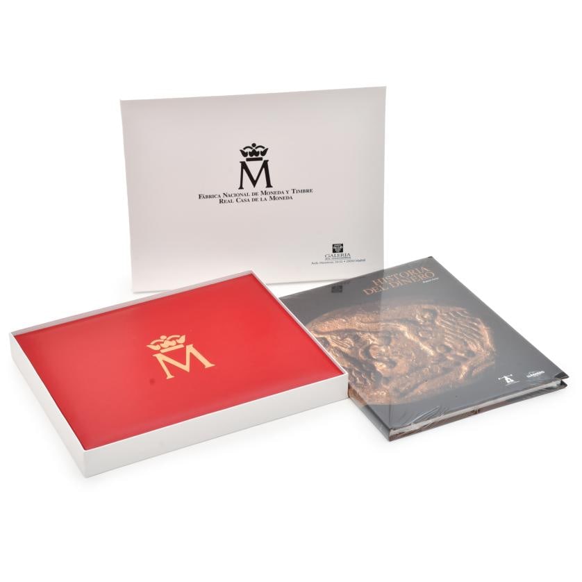 F?BRICA NACIONAL DE MONEDA Y TIMBRE - REAL CASA DE LA MONEDA. Special commemorative edition: Including replicas of the twenty-four silver and gold coins that represent the history of the peseta. The lot includes the book ‘Historia del dinero’ by Rafael Feria, published by the Museum of