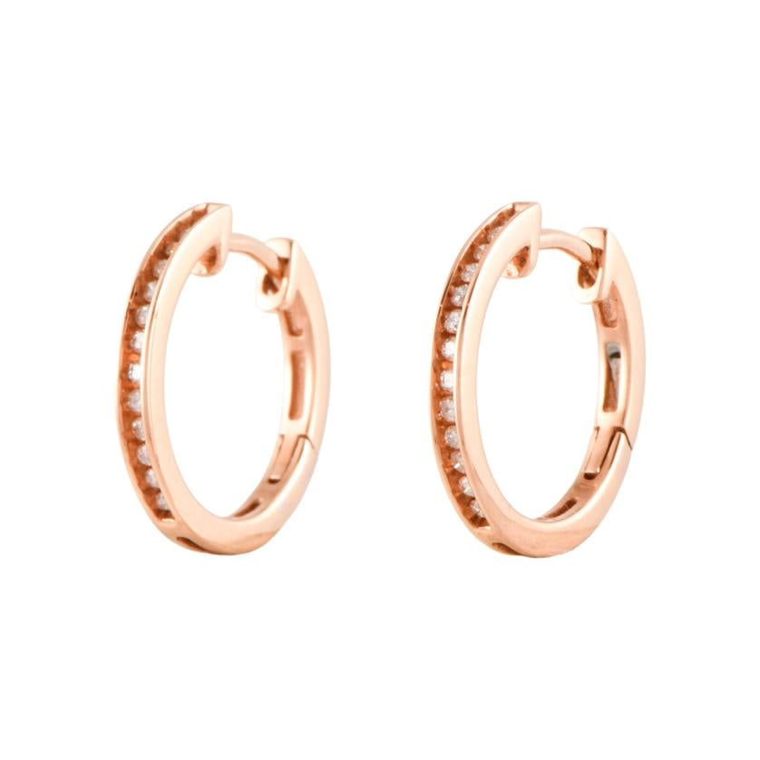 Diamonds hoop earrings.: 18 kt rose gold. Brilliant cut diamonds.Congo clasp.