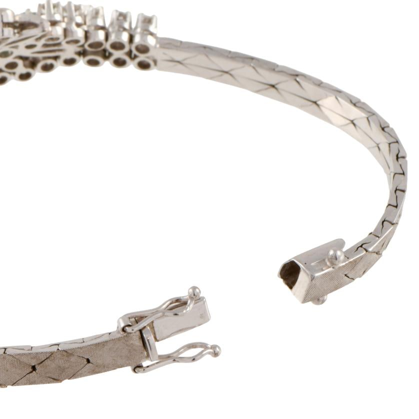 Semi-rigid bracelet with floral motifs, set with emeralds and diamonds. (1 of 1)
