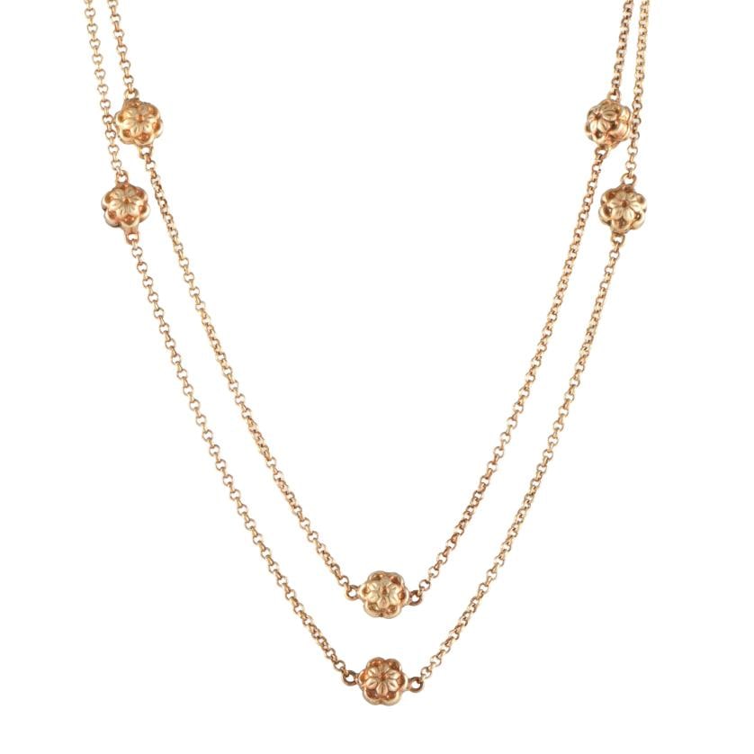 Links necklace with flower-shaped beads.: Gold-plated 925 silver.Carabiner clasp.45 cm open.