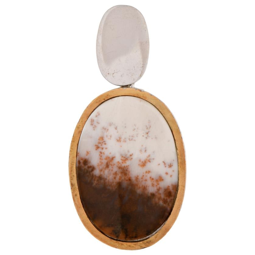 Pendant with a dendrite.: 925 silver with gold accents.70x34 mm.