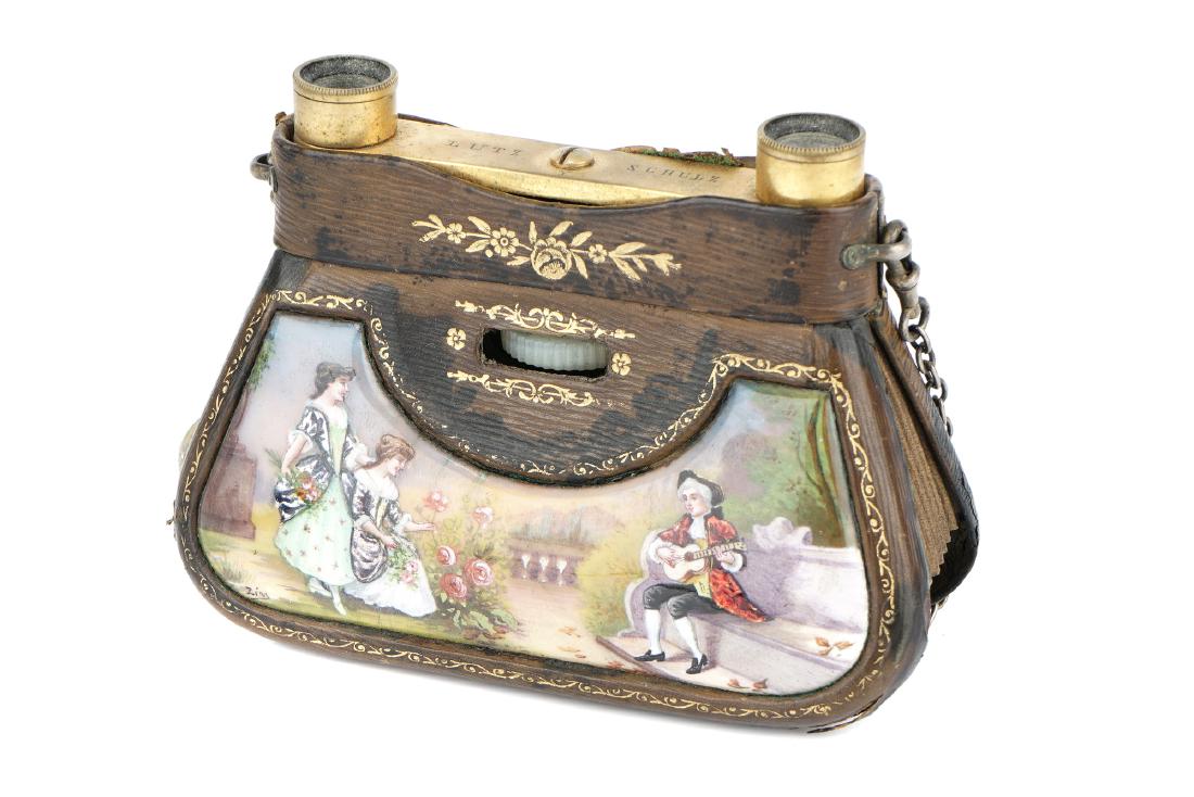 A Luxury Variant of 'La Mignonne' Opera Glasses,: Swiss, engraved Lutz Shultz, gilt brass and leather with painted porcelain panel, in green leather case, retailed by Lutz & Shultz Buenos Aires