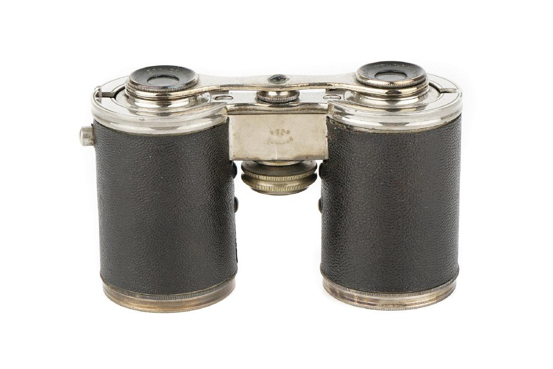 Levy's Patent Opera Glasses or Compact Binoculars,: French, C.1912-20, in nickel plate with leather barrels, with compass, marked 'Bianchetti 31 rue Cannebiere Marseille, Brevete SGDG' 11.5cm long as a cylinder, with original case also marked Bianchett