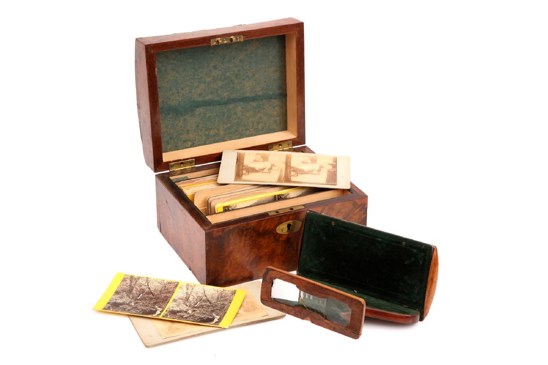 A Swans Stereoscopic Treasury,: English, c.1880, plaque to lid reads 'Swans's Stereoscopic Treasury', adjustable viewer in French polished burr walnut, with card stereoviews