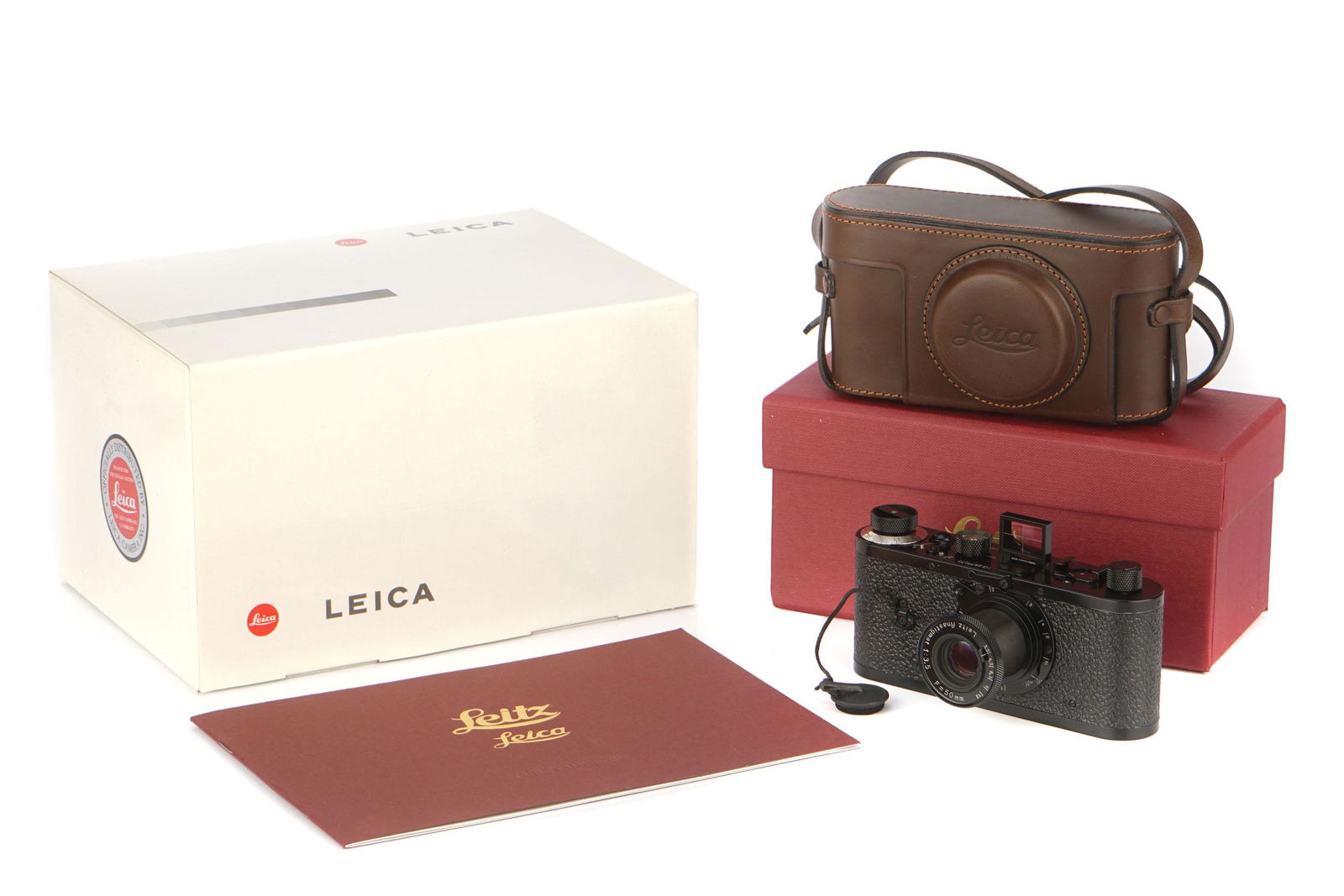 A Leica O-Series Replica Camera,: A Leica O-Series Replica Camera, 2000, black, serial no. 2677077, with Leitz Anastigmat f/3.5 50mm lens, body, E, shutter working, lens, VG-E, complete with ERC, paperwork and maker's boxes Notes: Mad