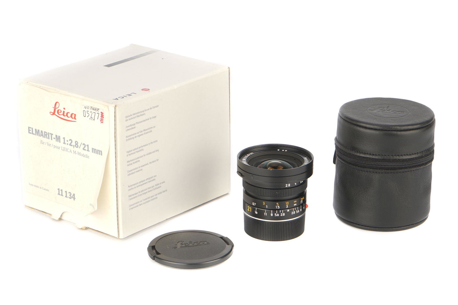A Leitz Elmarit-M f/2.8 21mm Lens,: A Leitz Elmarit-M f/2.8 21mm Lens, 1993, E60, black, serial no. 3641510, body, E, elements, VG, some light internal haze, complete with lens caps, in maker's box