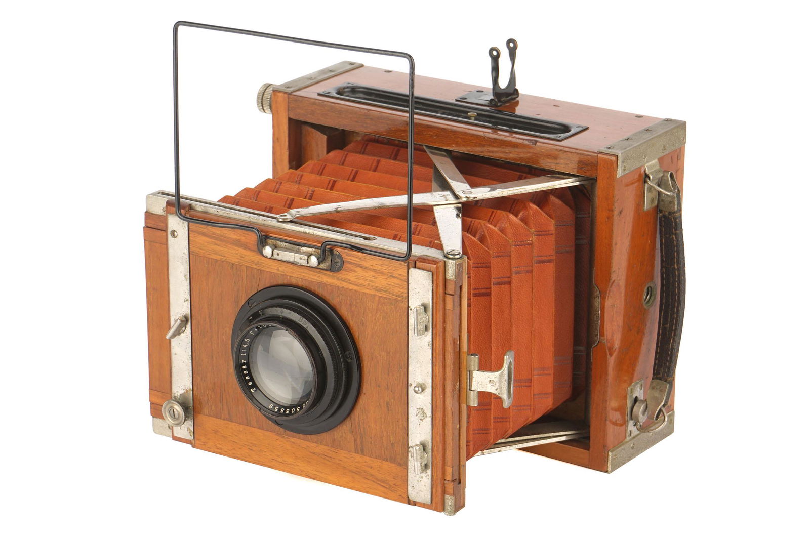 A Contessa Nettel Deckrullo-Nettel Tropen 9x12cm: A Contessa Nettel Deckrullo-Nettel Tropen 9x12cm Camera, 1919-26, teak, serial no. S9484, with Carl Zeiss Jena Tessar f/4.5 150mm lens, serial no. 503559, body, VG, shutter requires attention, lens, V