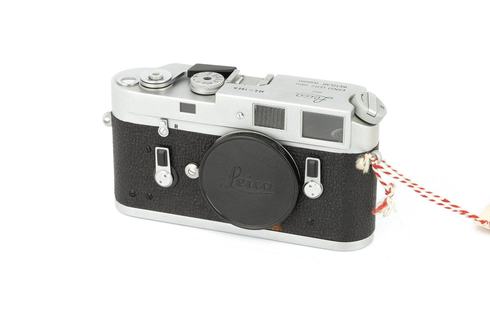 A Leica M4 'Attrappe' Rangefinder Body,: 1967-75, chrome, serial no. 192A, body, VG-E, complete with Leica service card Note: Non-working display model Note: Lot imported under Temporary Admission. 5% UK import VAT will be charged on the â�