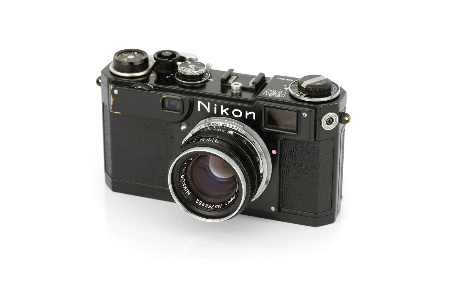 A Nikon S2 'Black Dial' Rangefinder Camera,: 1954-58, black, serial no. 6180885, with Nippon Kogaku Nikkor-H f/2 50mm lens, black, serial no. 755982, body, VG, shutter working, lens, G, some light cleaning marks and some internal marks, complete