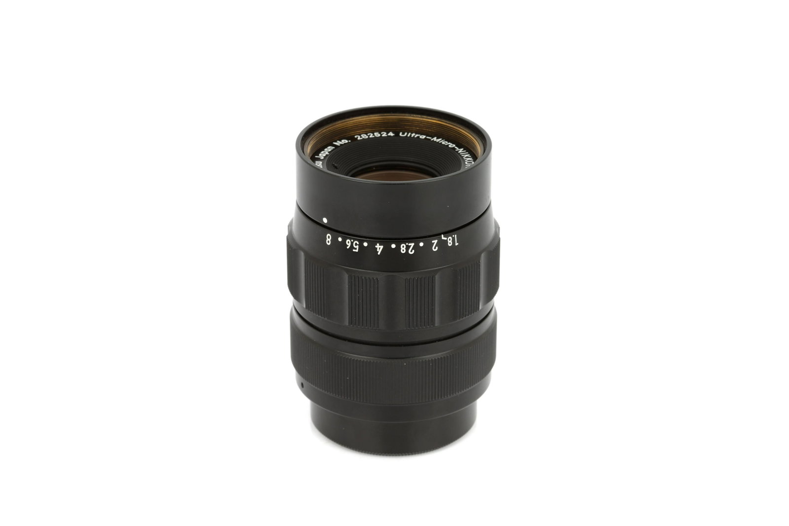 A Nippon Kogaku Ultra-Micro-Nikkor M=1/10 f/1.8 28mm: black, serial no. 282524, body, VG-E, elements, E, in maker's box