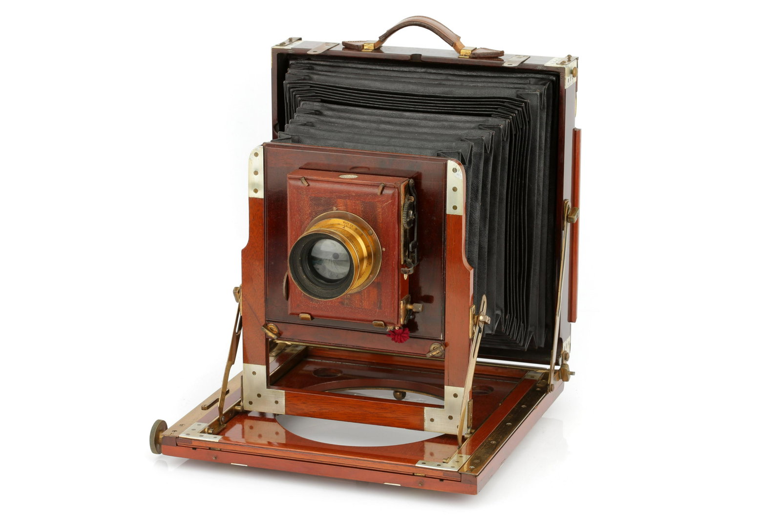 A Thornton Pickard Ruby Whole Plate Mahogany Field: 1899-1908, serial no. 7503F, with Ross Symmetrical Anastigmat g/5.6 7½" lens, brass, serial no. 58380, body, G, shutter working, some later replaced aluminium bindings, lens, G-VG, some haze, t