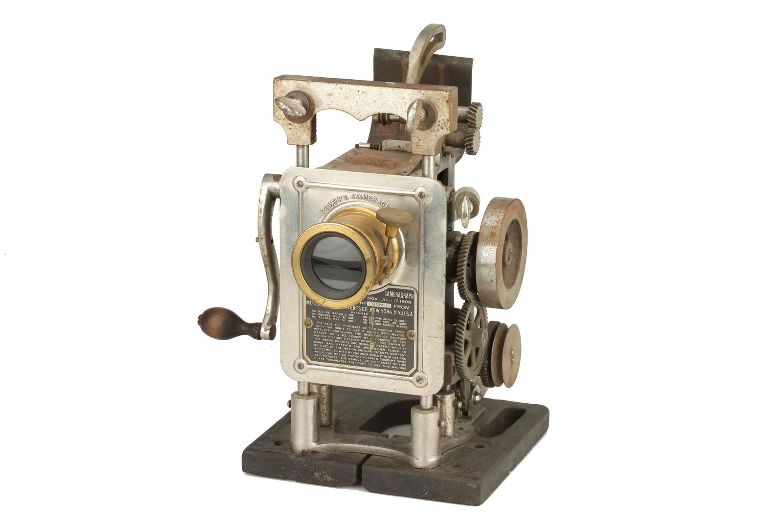 A Powers Cameragraph No.5 Hand Crank 35mm Projector,: serial no. 6717, nickelled-metal fittings, with a brass-bound lens and hand-crank Provenance: Ex-Christies lot 48, 6th May 2005 Note: Lot imported under Temporary Admission. 5% UK import VAT will be c